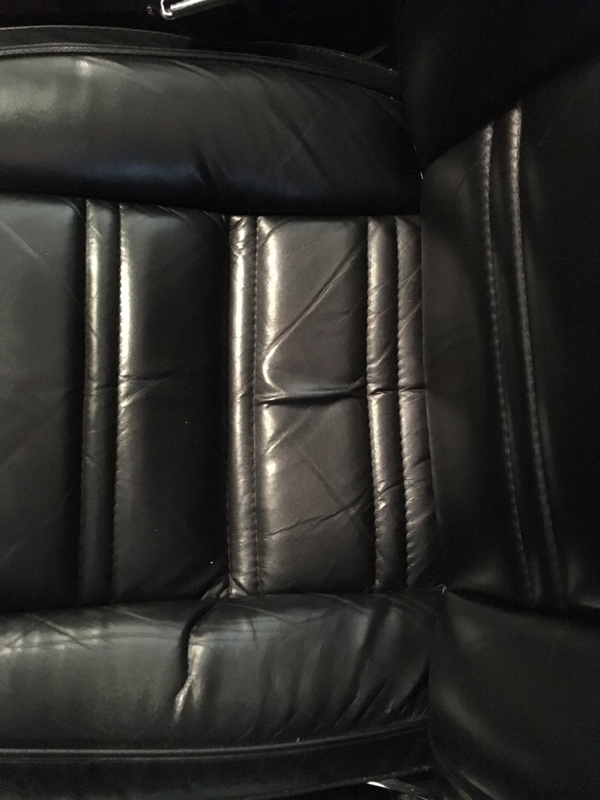 Premium Photo  Process of applying foam on black leather seat